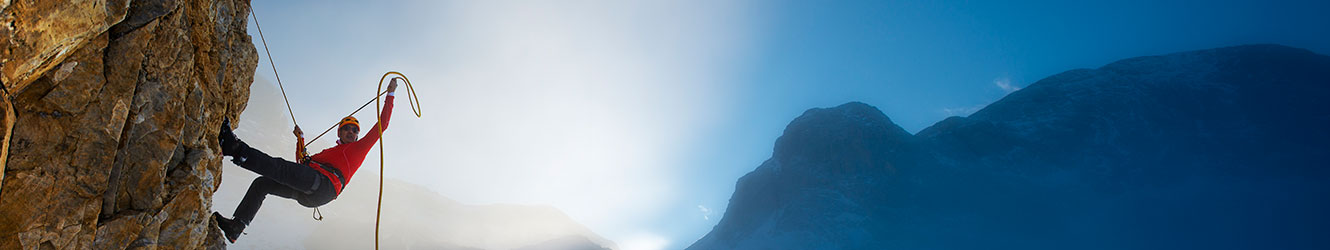 Man climbing a cliff.